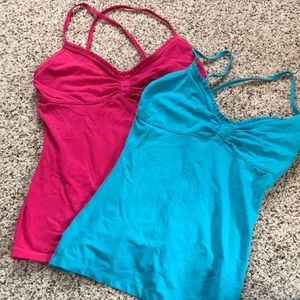 Two hollister criss cross back tank tops